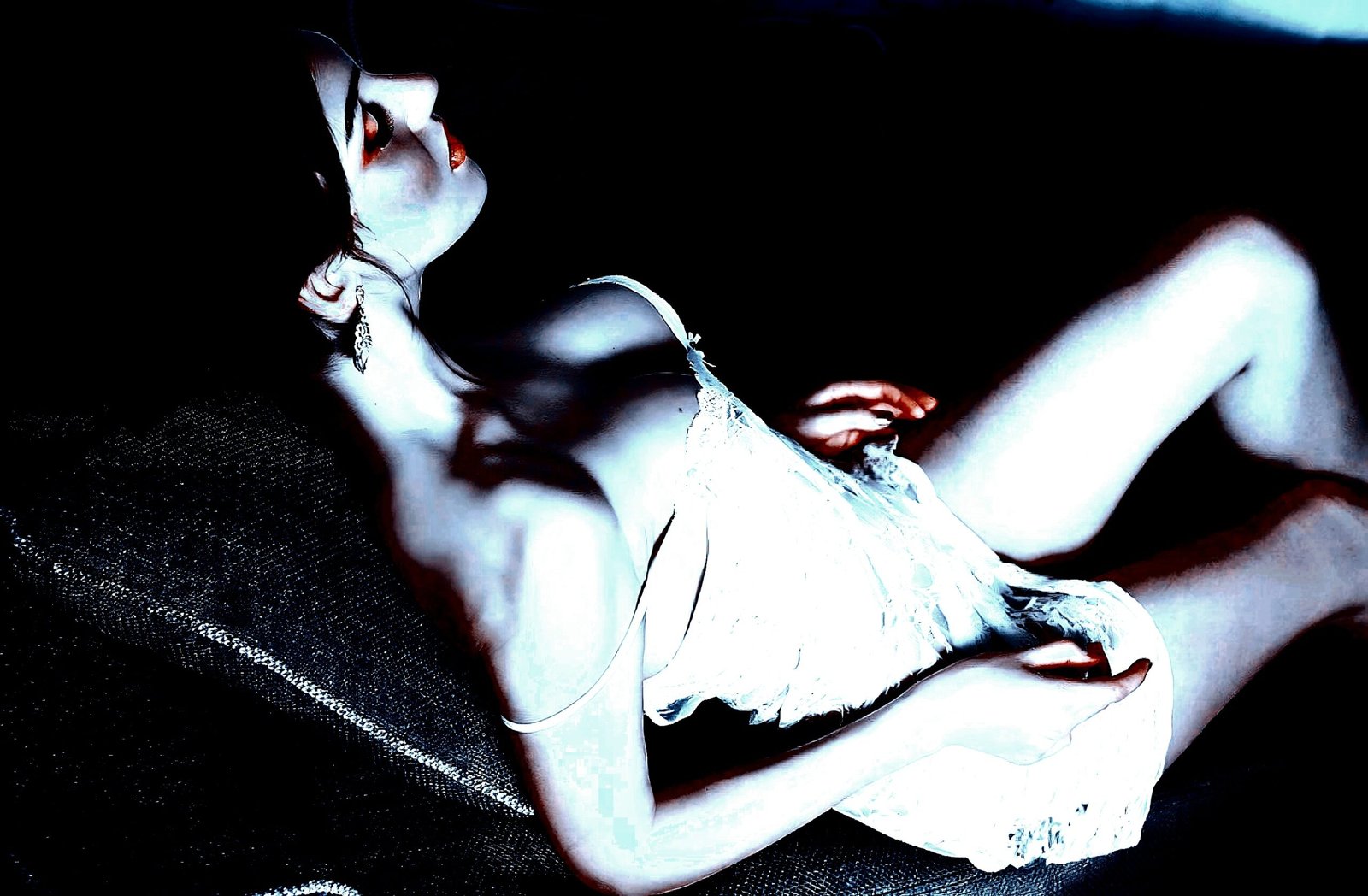 Ethereal portrayal of gender fluidity with a person in a delicate, reclined position.