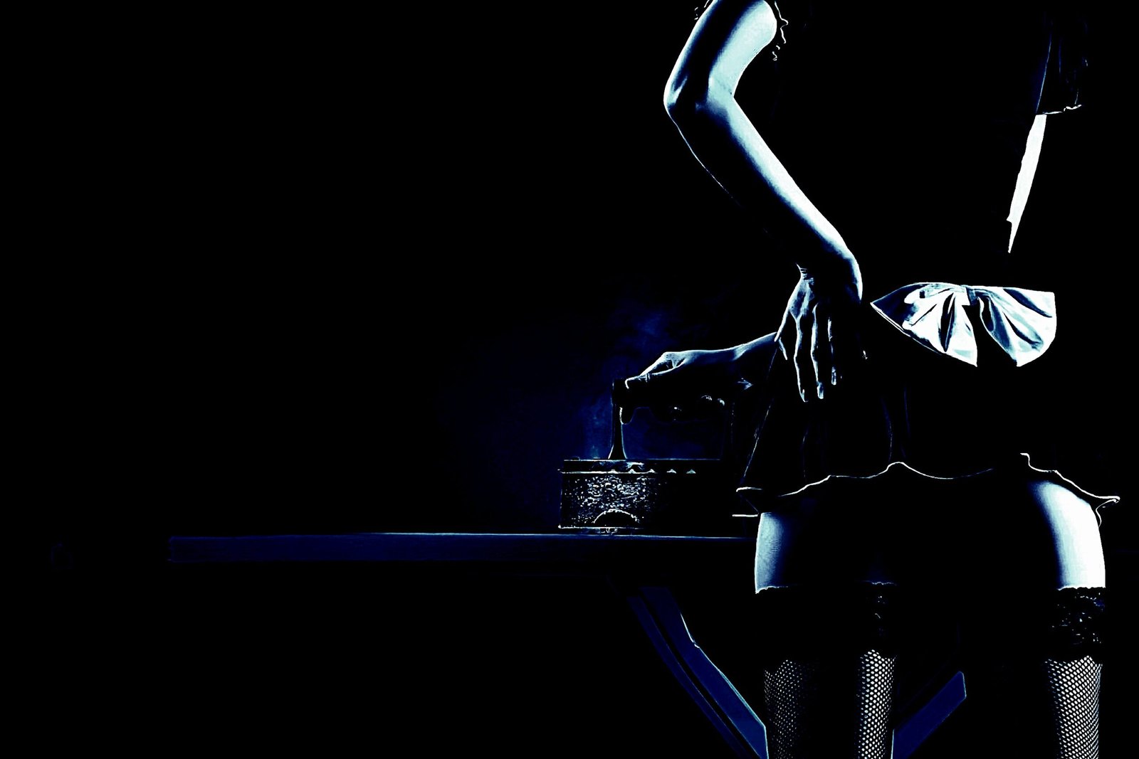 A gothic scene with a woman in a short skirt and fishnet stockings standing by a dimly lit bar.