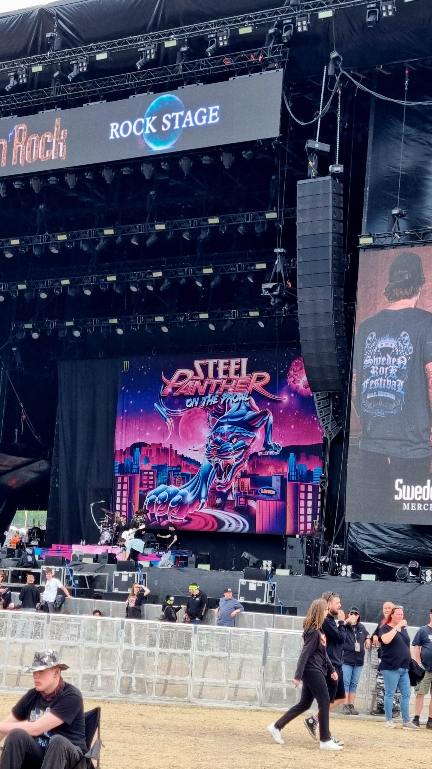 Steel Panther stage setup with colorful backdrop at Sweden Rock Festival 2024