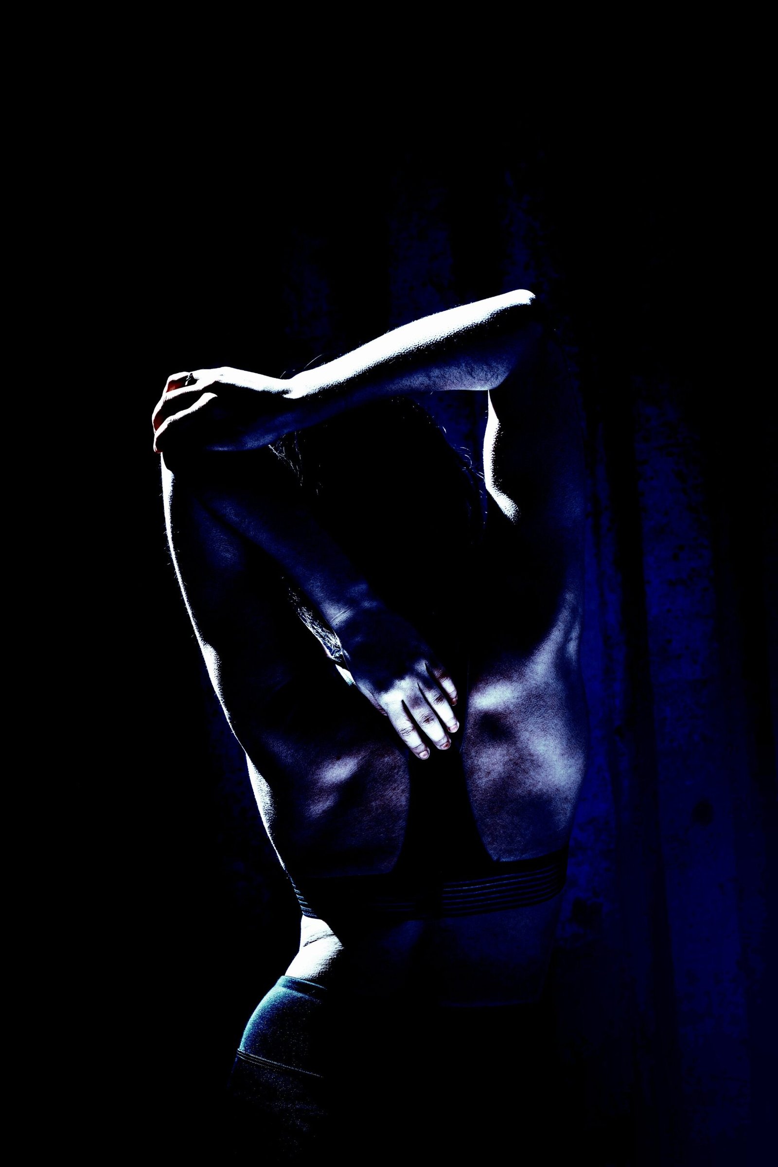 Woman in athletic wear preparing for a workout in an urban environment, symbolizing Heavy Metal Yoga