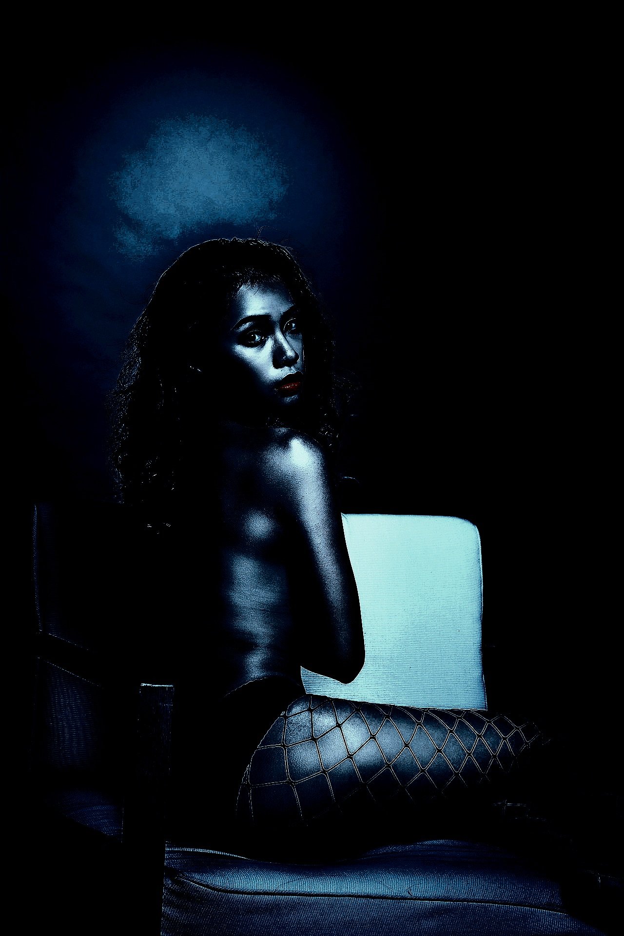 Artistic nude figure with dramatic shadows