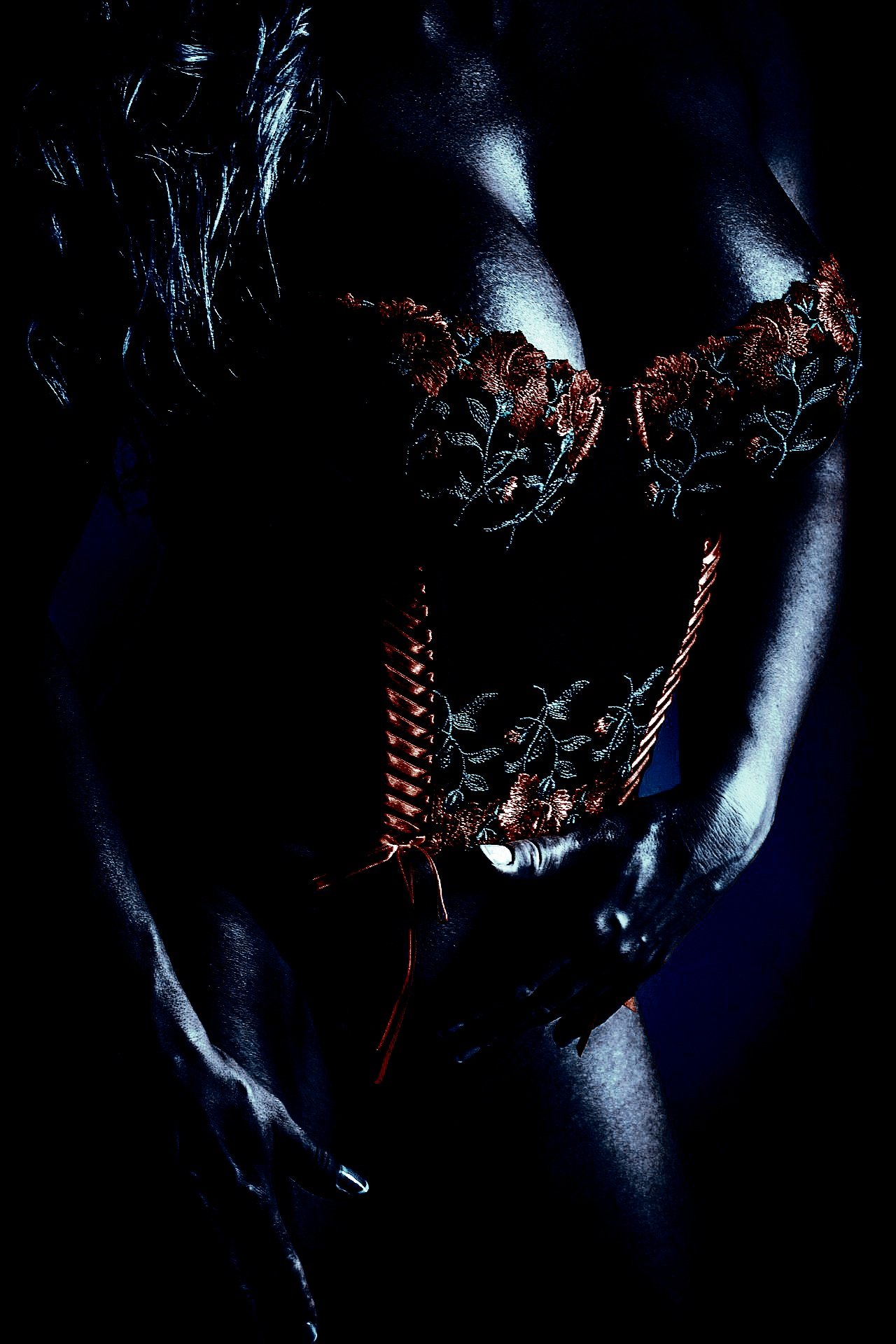 Artistic depiction of a nude model with abstract lighting
