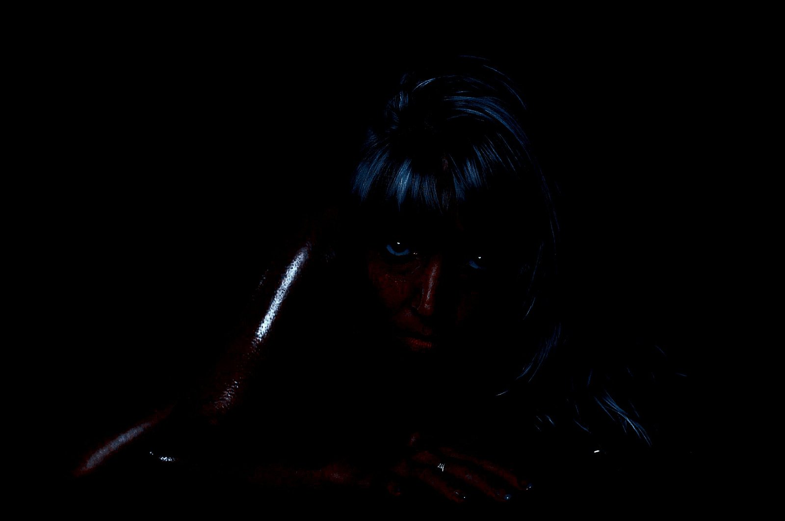 Artistic nude figure in low light with shadows