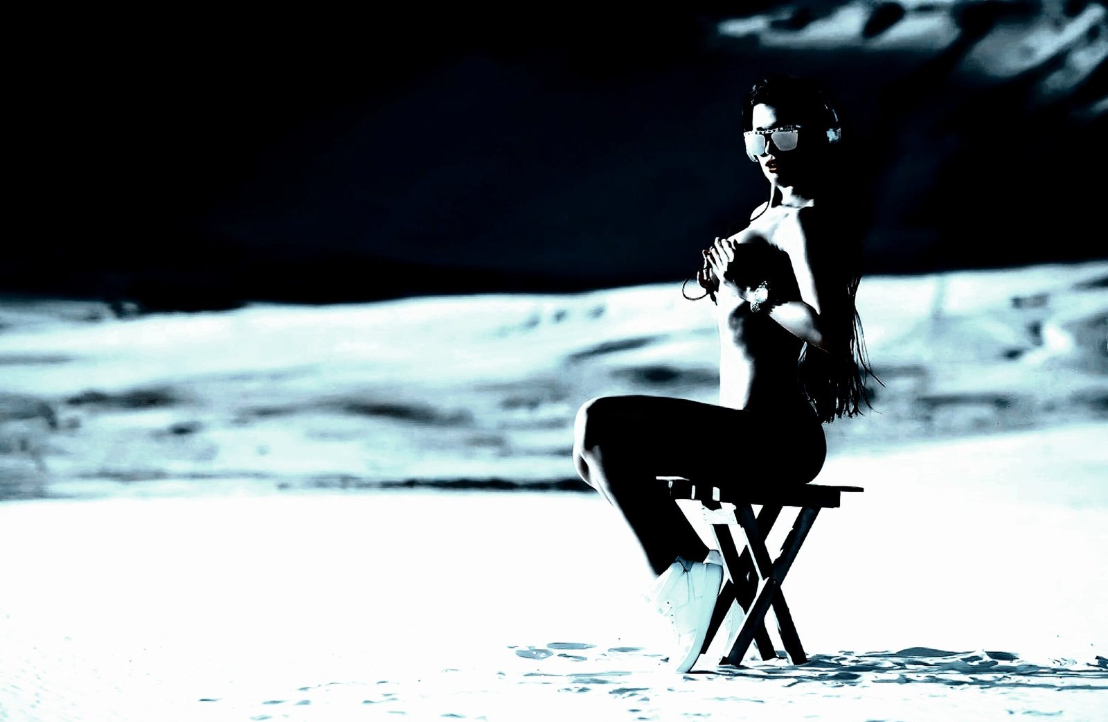 Woman in an alluring pose, representing the dark elegance of BDSM practices.