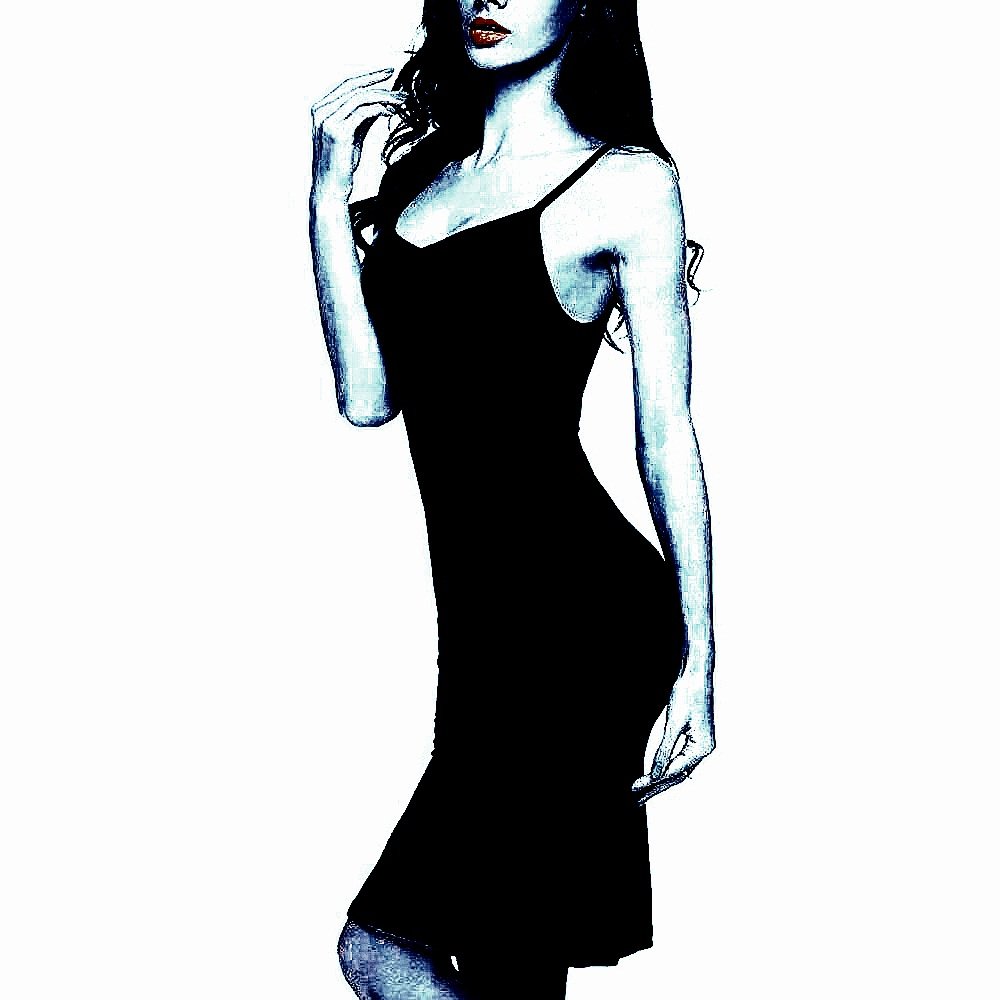 Slim woman in a simple black spaghetti strap goth summer dress, striking a confident pose.