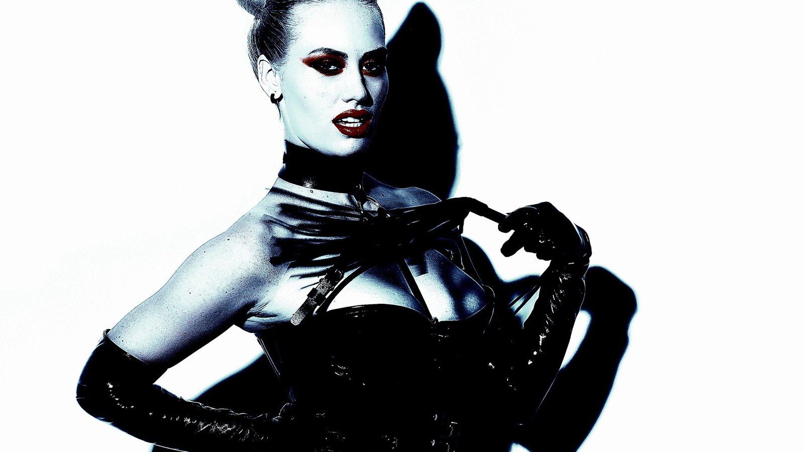 A woman in BDSM attire demonstrating the intricate dynamics of BDSM extreme pain processing, highlighting the psychological and emotional aspects of pain.