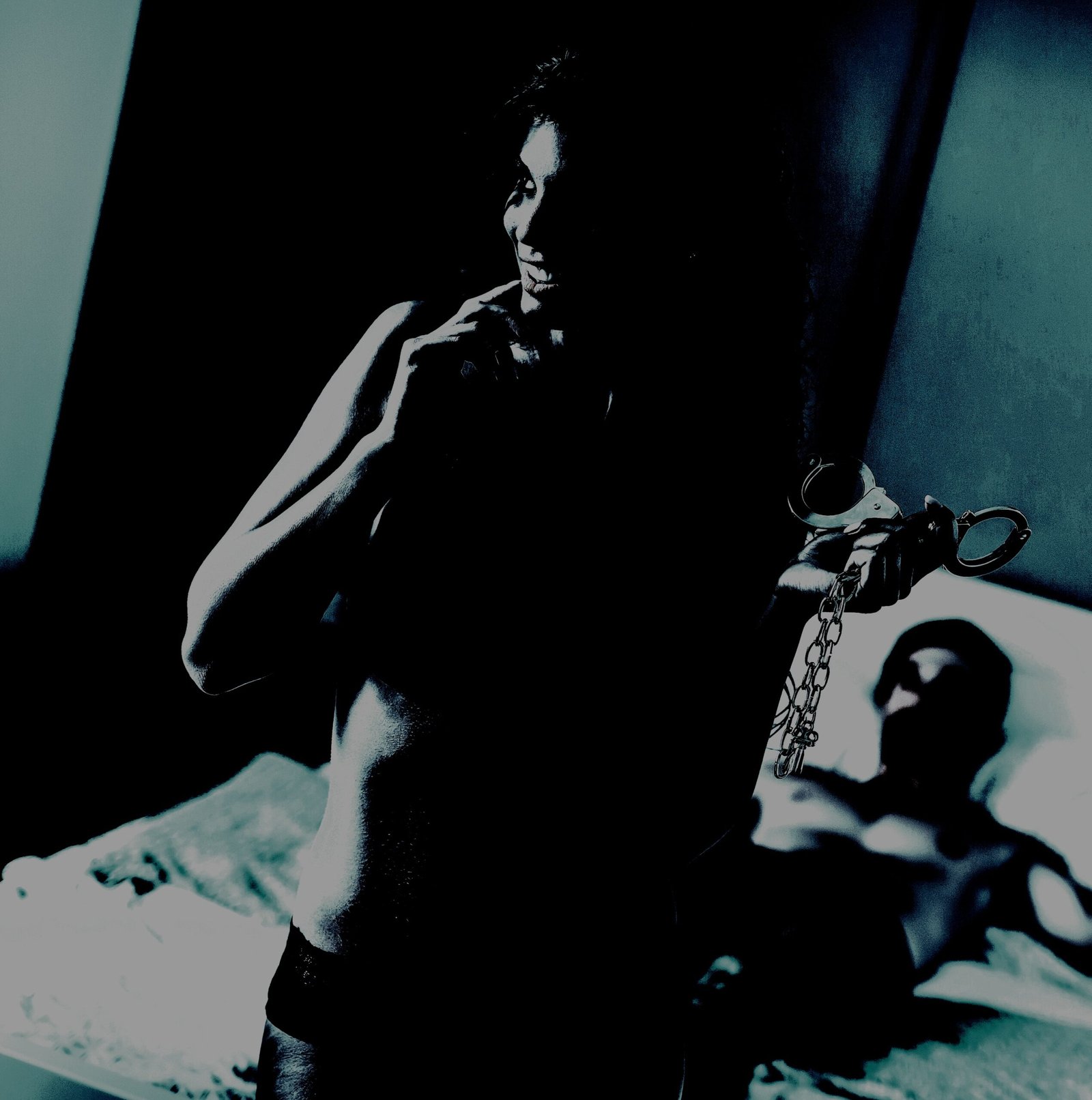 Playful older woman holding handcuffs, highlighting a mysterious and adventurous relationship dynamic.