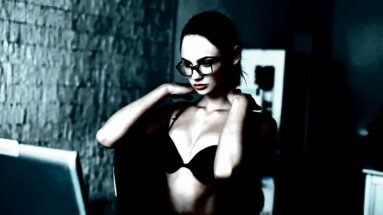 Woman in black lingerie and glasses looking at her reflection, with an intense and focused expression