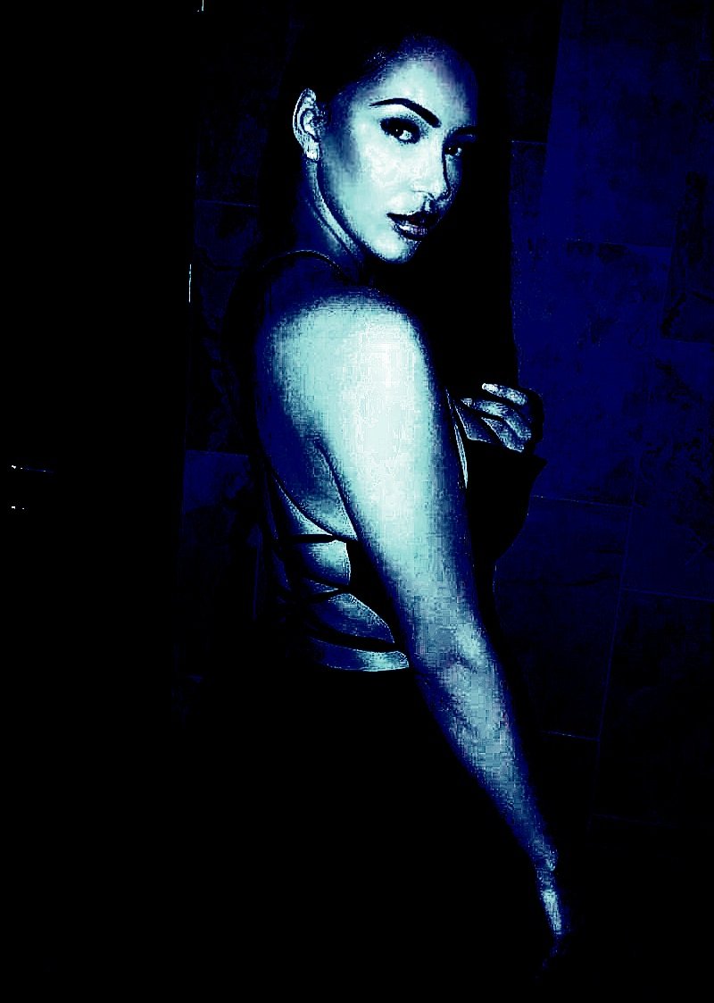 Gothic woman in a dark dress with a backless design