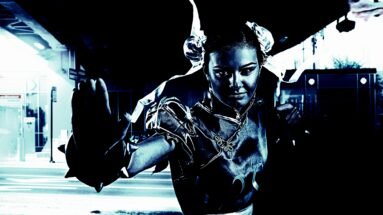 Metalhead cosplayer in a combat-ready pose, dressed as a character with twin buns and ribbons in a dark urban setting.