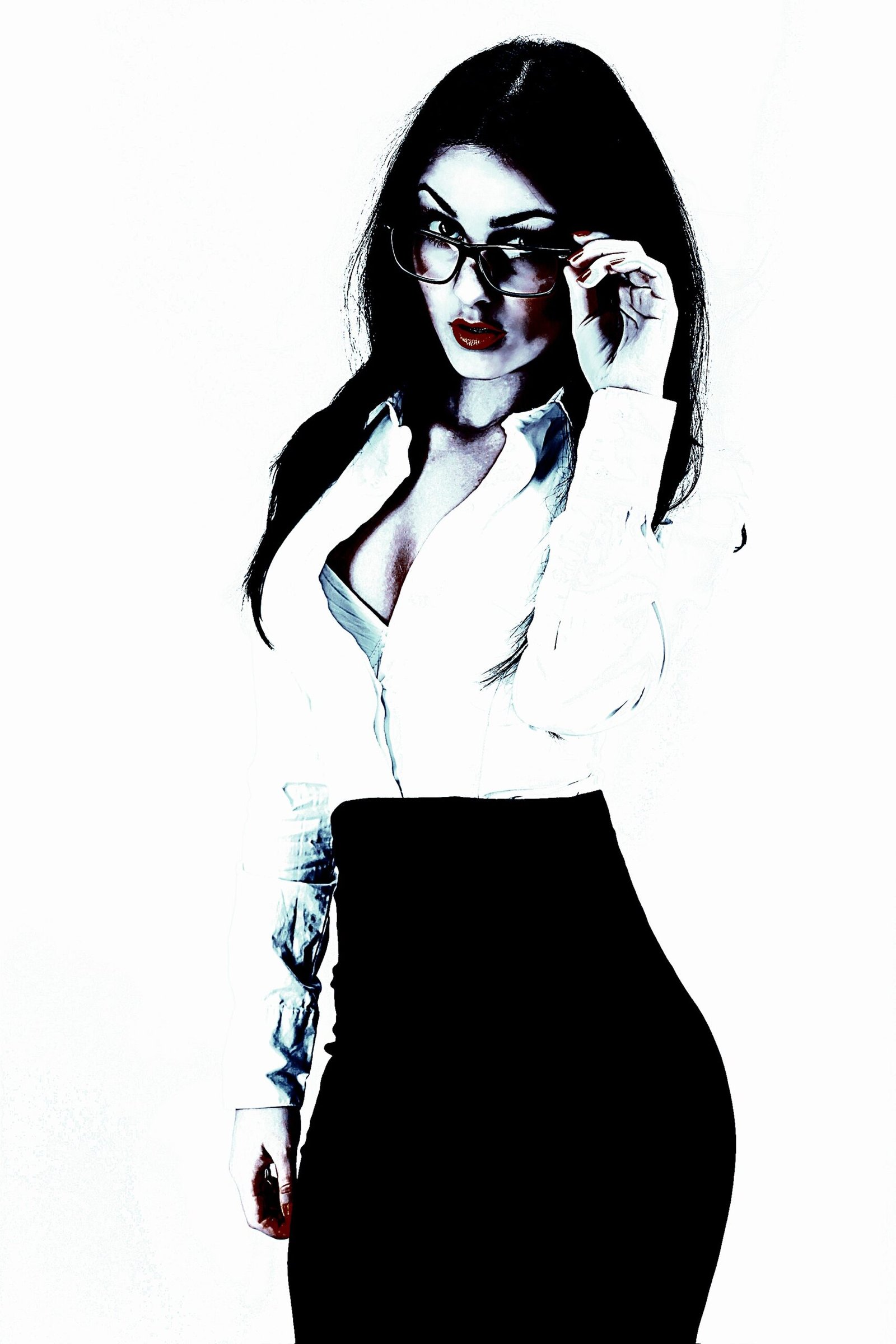 Professional woman in glasses, dressed in a white blouse and black pencil skirt, adjusting her glasses while striking a confident pose against a white background.