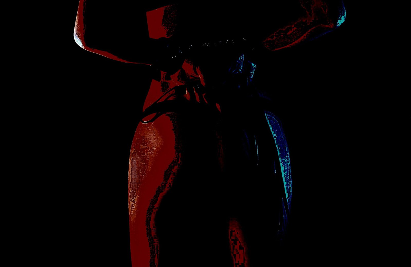 Silhouette of a person adjusting their outfit in a dark, intimate setting.