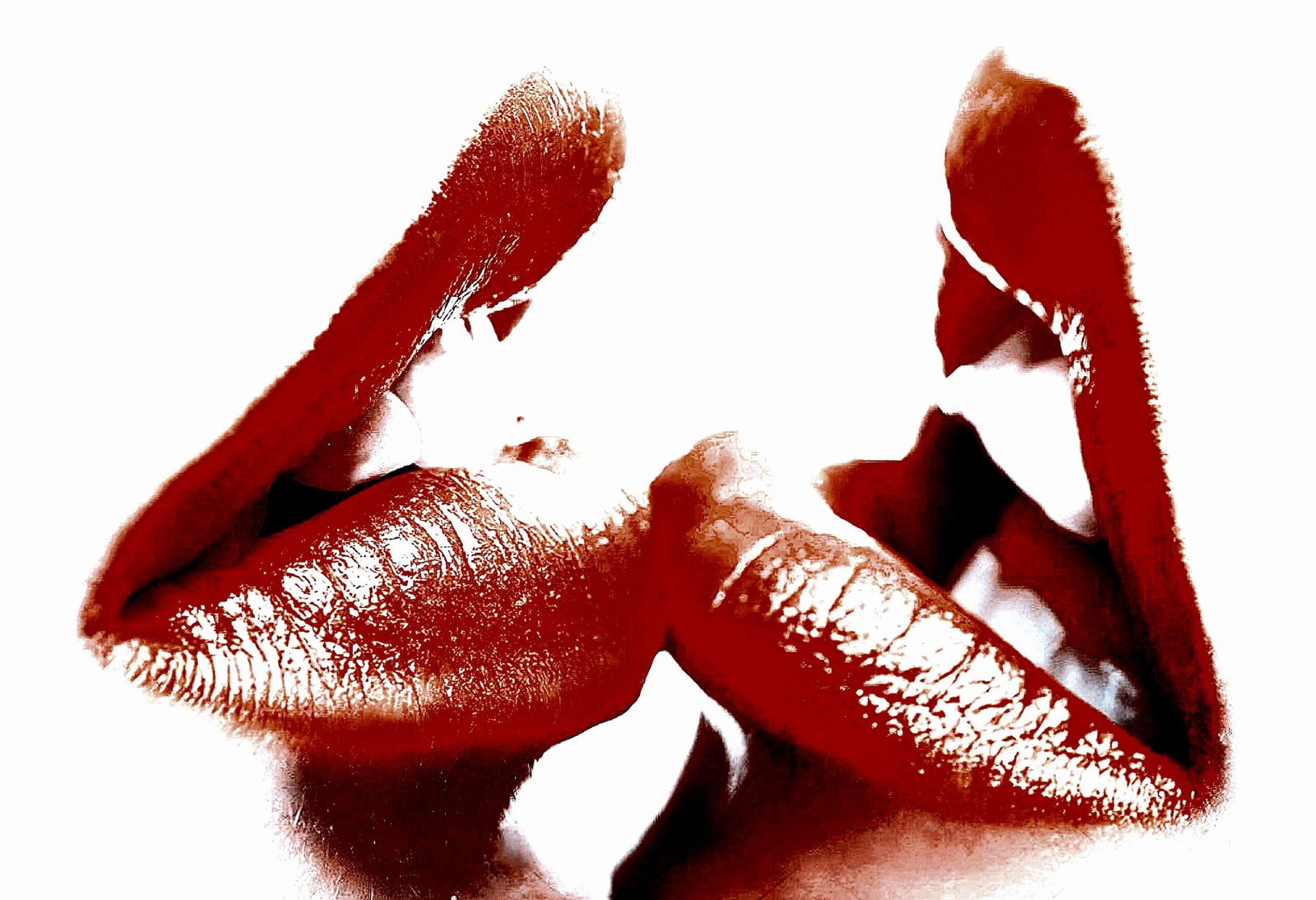 Close-up of two pairs of lips in an almost-kiss, emphasizing desire and passion with a striking red and white contrast.