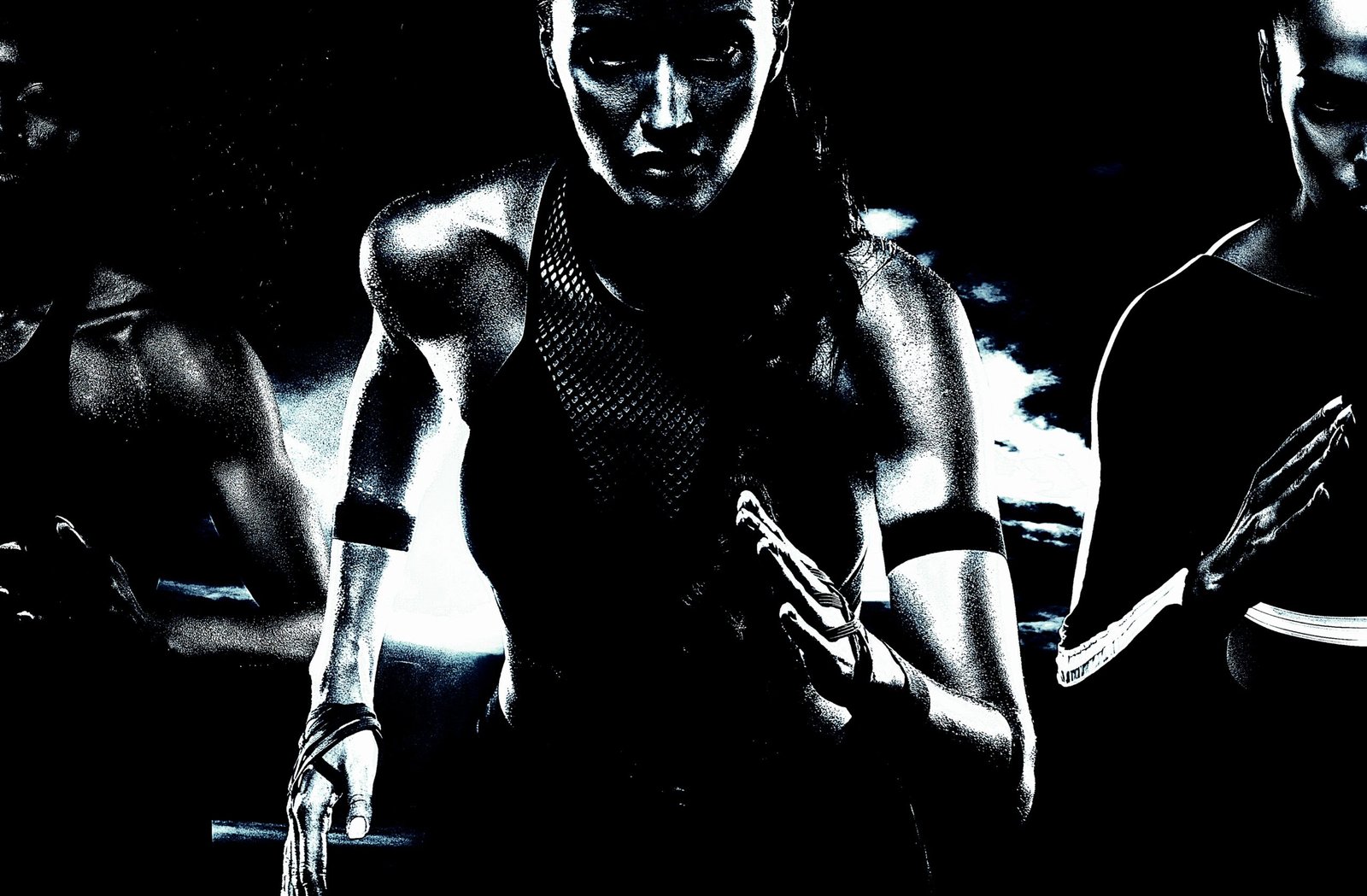 Group of women sprinting in a high-intensity workout, featuring powerful body movements and strong muscular definition.