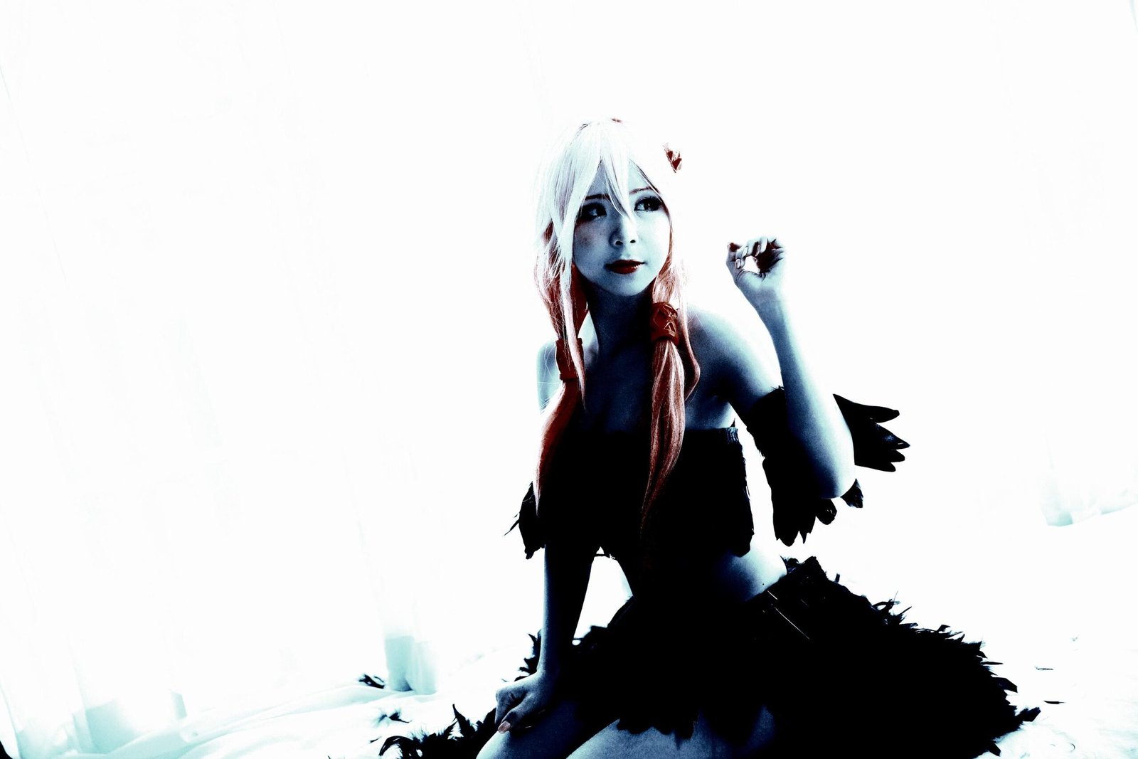 Light-toned cosplay featuring a fairy-like character with white hair and delicate features, seated in a dreamy, ethereal pose.