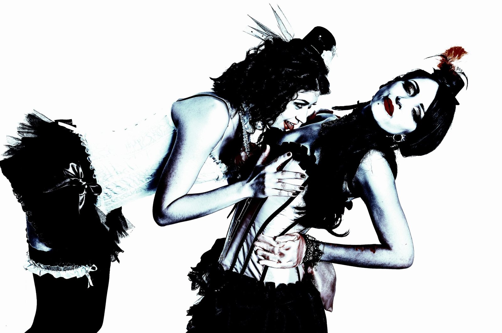 Two women in elaborate burlesque-style corsets, engaging in playful, suggestive interaction with intense expressions, captured in a dramatic, gothic atmosphere.