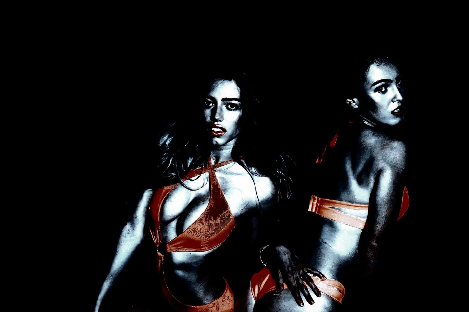 Two women in red bikinis posing against a black background, evoking a sense of bold sensuality.