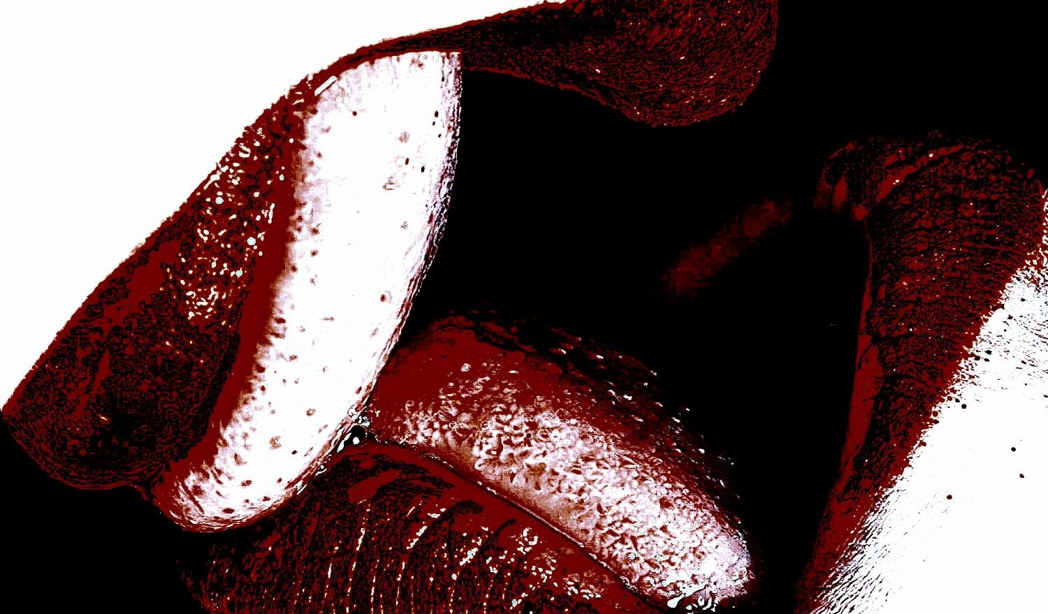 Close-up of glossy, red-stained lips with a dramatic, artistic texture.