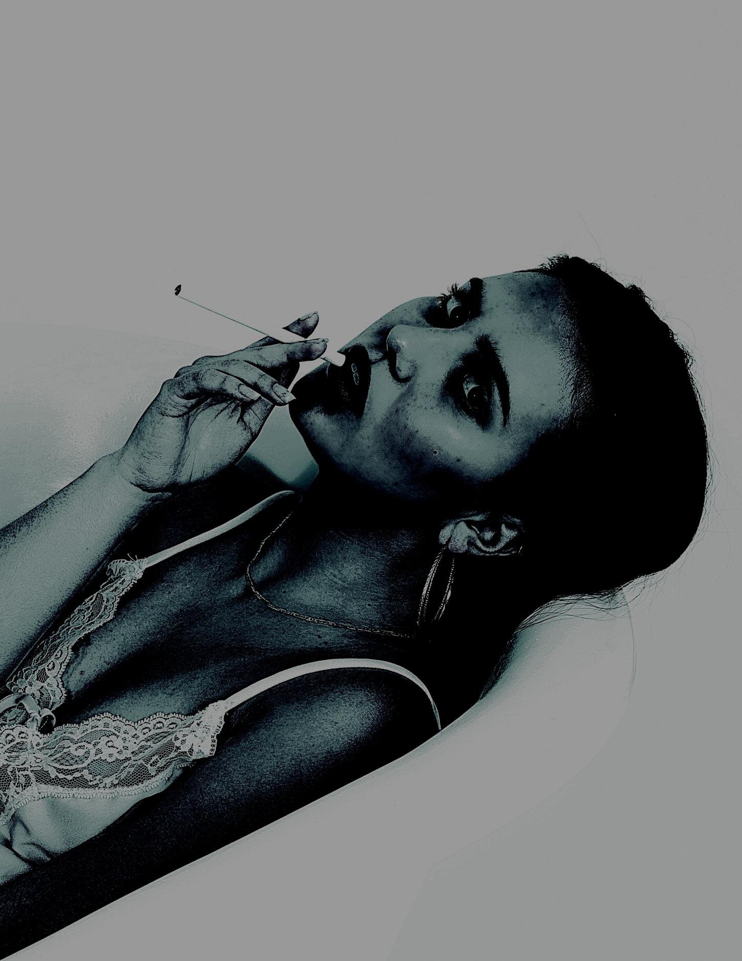 Sultry woman in lace lingerie lounging in a bathtub, smoking a cigarette with a dark, intense gaze.