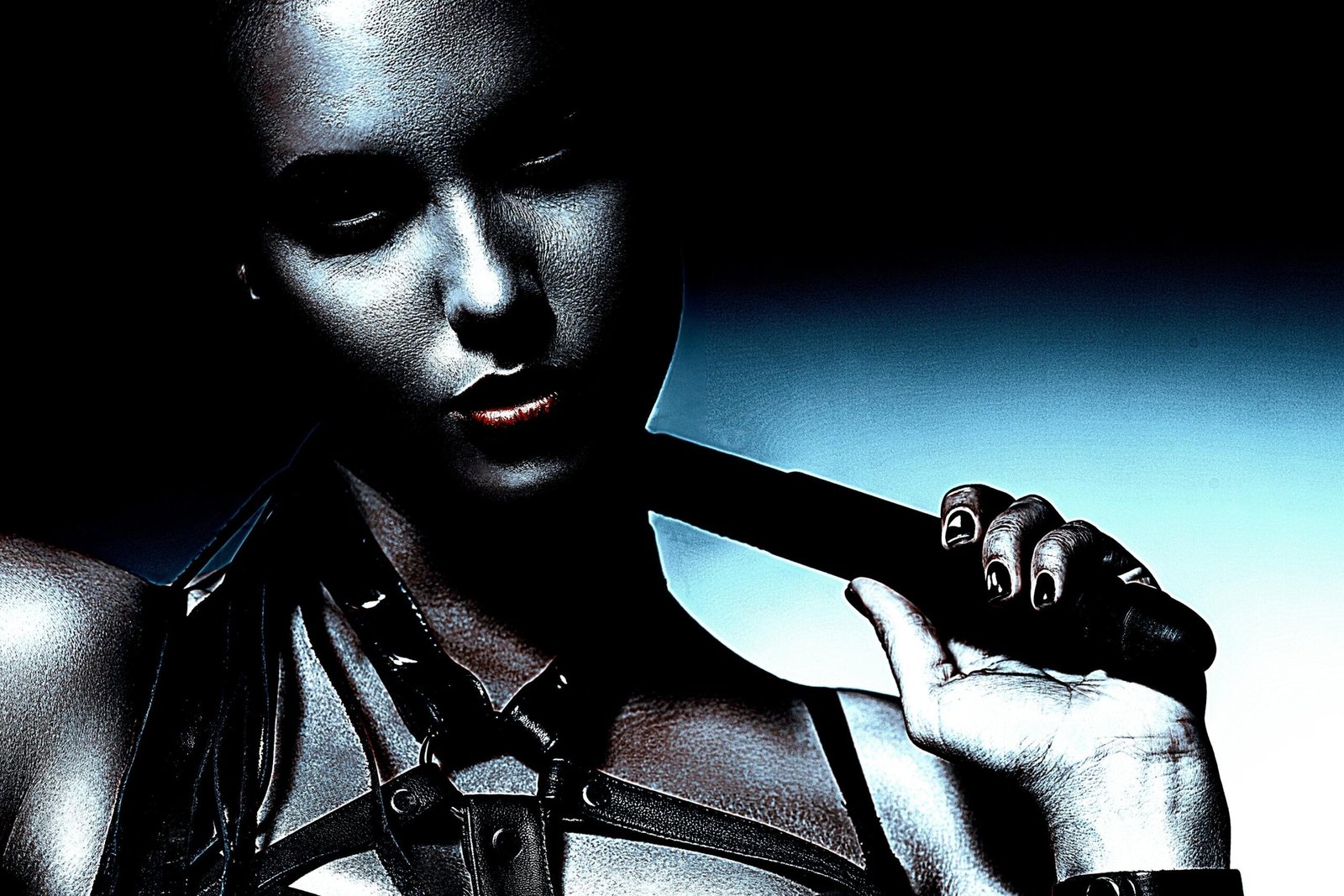 Close-up of woman in leather harness corset holding a strap across her shoulder