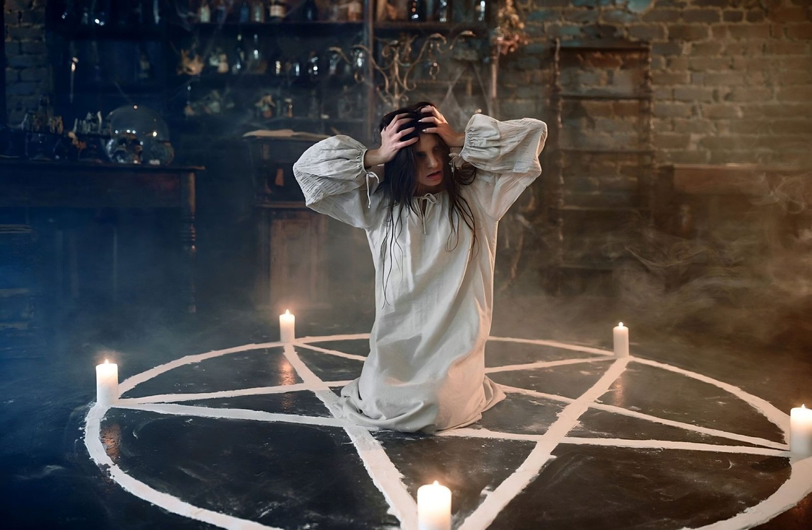 Gothic demoness with horns and wings, wearing dark armor, standing powerfully in a dungeon-like setting.