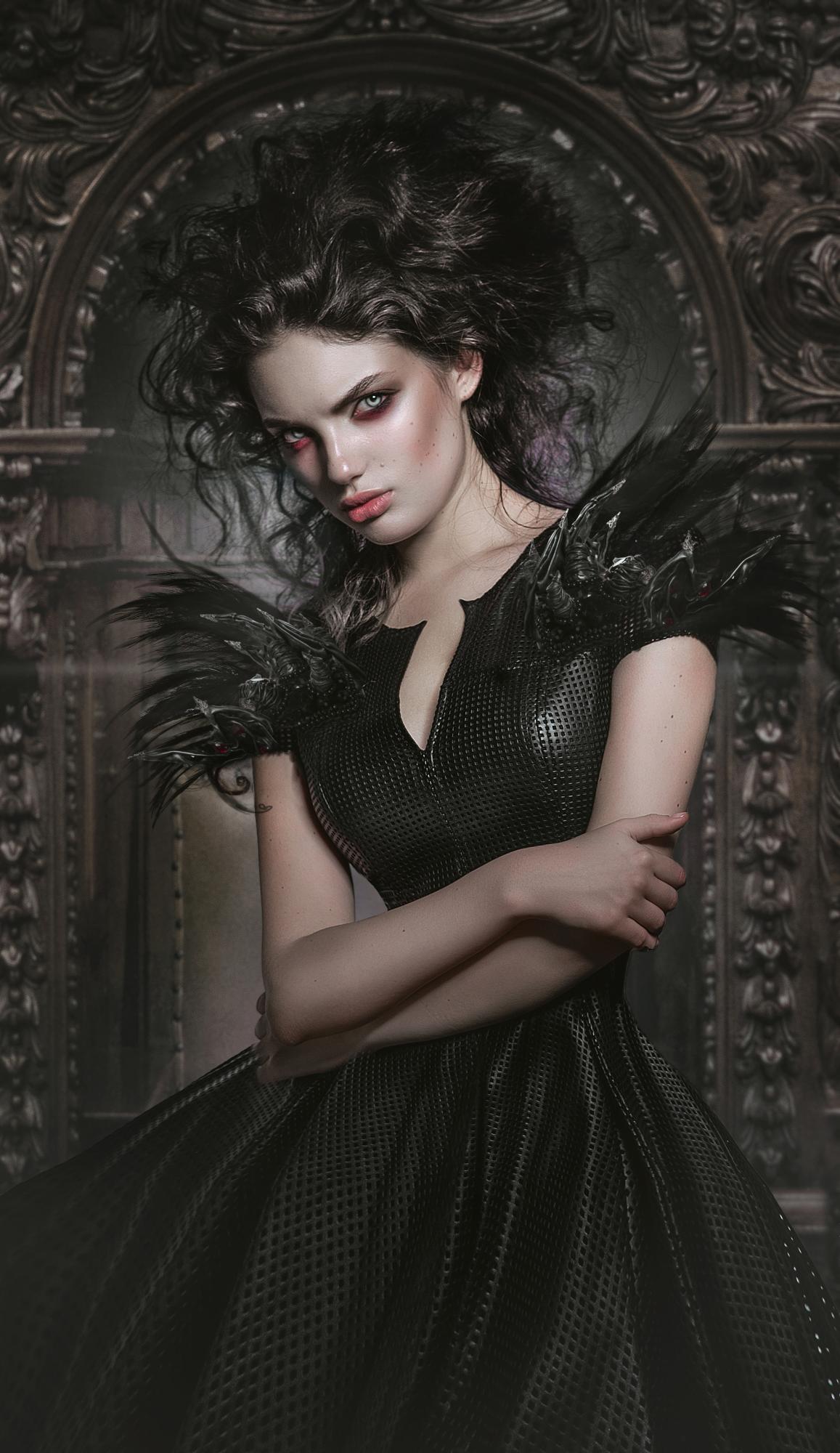 Gothic woman in black feathered dress with dramatic makeup standing before ornate dark throne backdrop.